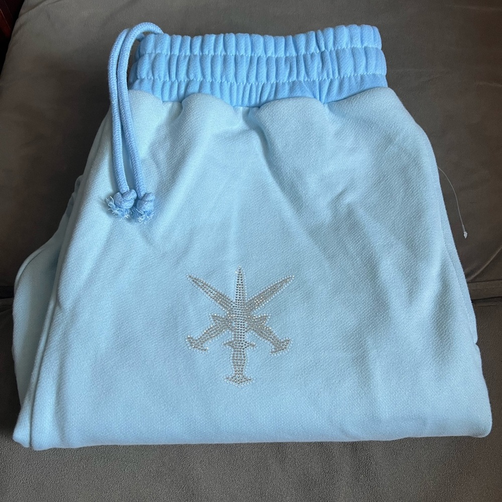 Baby Blue Sweatpants with Embellished Logo UNKNOWN LONDON